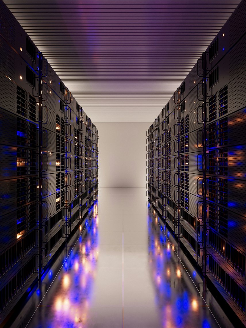 Server room aisle with illuminated equipment racks representing scalable software infrastructure